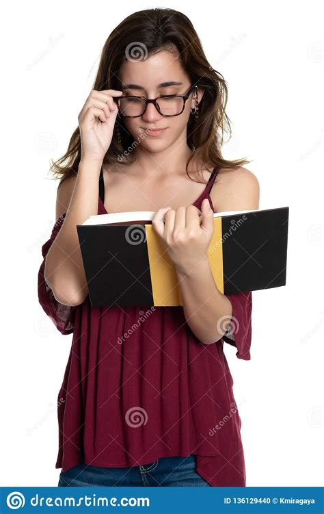 Hispanic Teenage Girl With Glasses Reading A Book On A
