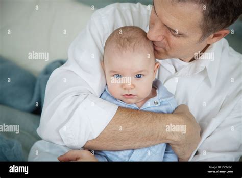 Father Hugging Baby Stock Photo Alamy
