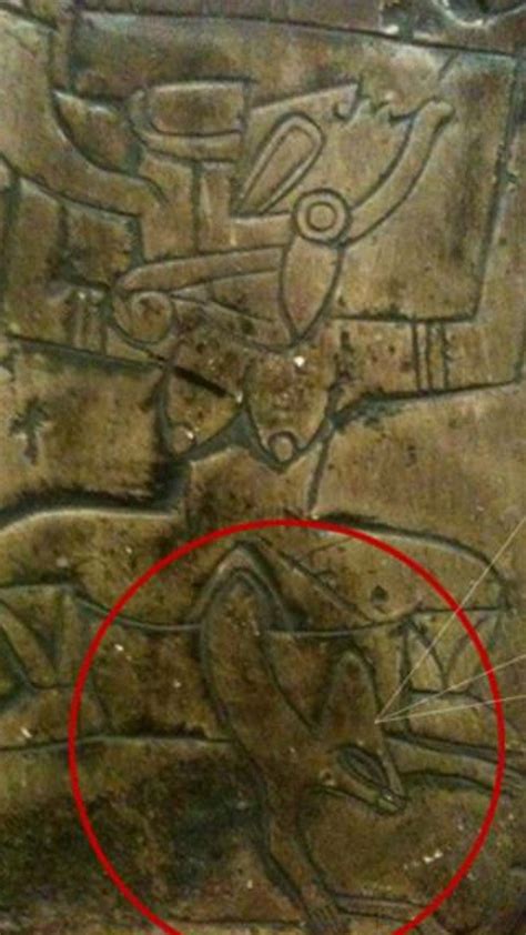 depicting a picture of a woman giving birth to a reptilian nephilim ancient artefacts