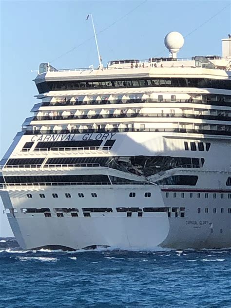 Carnival Glory just hit Carnival Legend. Taken from ashore in Cozumel