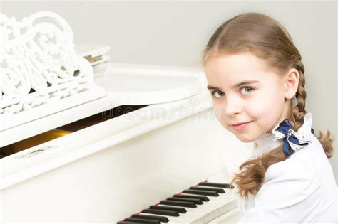A Girl From A Music School Plays The Piano Stock Photo Image Of