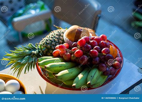 Metal Fruit Bowl On A Wooden Surface Close Bananas Oranges And