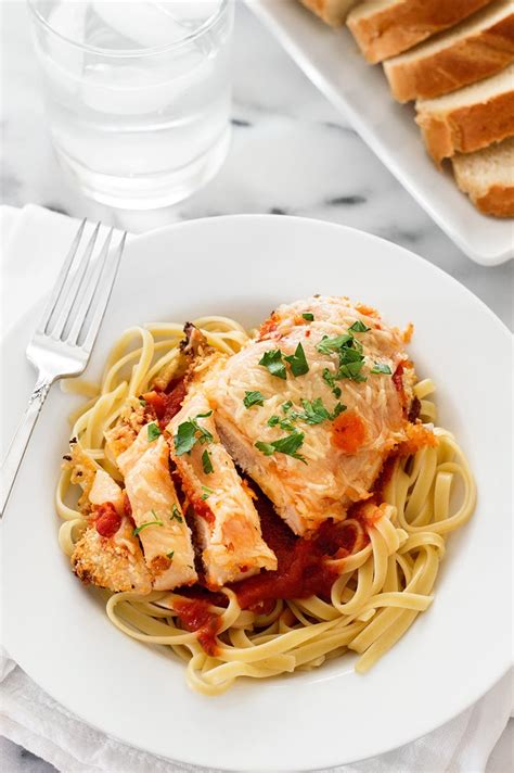 This parmesan chicken recipe only has a few ingredients, quick prep time and tastes amazing. Easy Baked Chicken Parmesan for Two - Baking Mischief