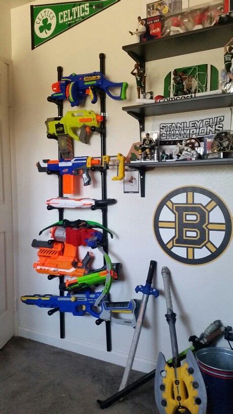 This will apply to those of you who have children obsessed with nerf guns. Nerf storage ideas! - A girl and a glue gun