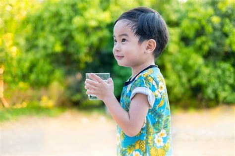 Premium Photo Asian Cute Smile Boy Drinking Water For Healthy And