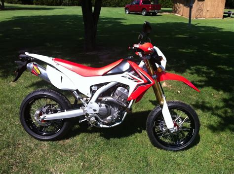 I modify most motorcycles that i buy. Honda CRF250L with supermoto exhaust, rims, brakes & tyres ...