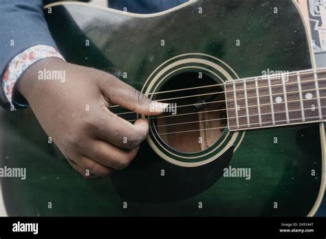 Closeup Shot Of A Black Man Playing The Guitar Stock Photo Alamy