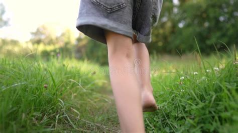 Bare Feet Walking On The Grass A Teenager Girl Takes Off Her Shoes Walking Bare Bare Feet On