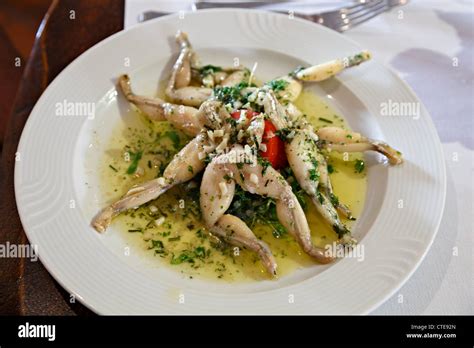 Frogs Legs In Garlic Butter Sauce Stock Photo Alamy