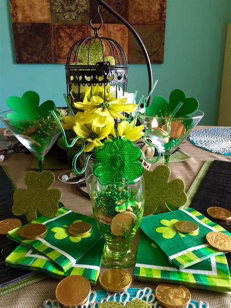 A St Patrick S Day Table Setting With Shamrock Napkins And Gold Coins