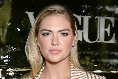 Kate Upton Impressively Balances Upside Down In Chic Red Hot Pink Sports Bra Leggings For