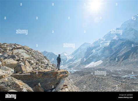 Male Backpacker Enjoying The View On Mountain Walk In Himalayas