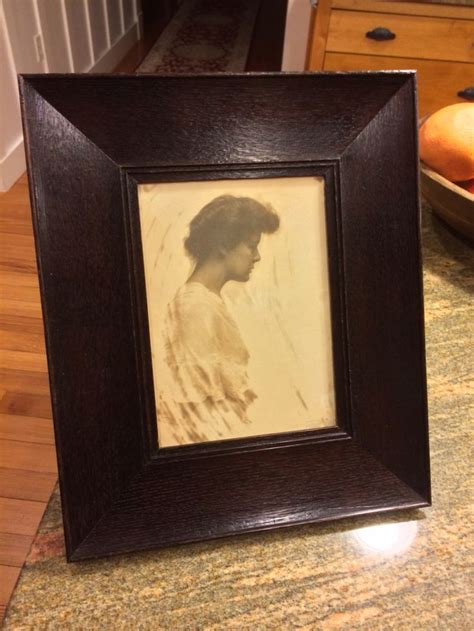 An Old Photo Frame Sitting On Top Of A Counter