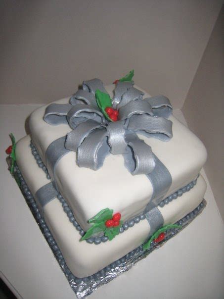 How to make a fondant gift box covered in smooth fondant icing design with bow on top sprayed in gold the bow was made for christmas gift ideas how to make. Two Sweet Bakery: Two tier square Christmas holly cake