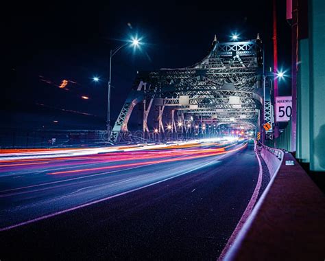 Long Exposure Of Traffic Lights On A Highway Illuminated At Night