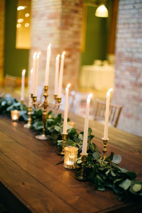 Brass Candlesticks Mercury Glass Votives And Greenery Wedding Floral