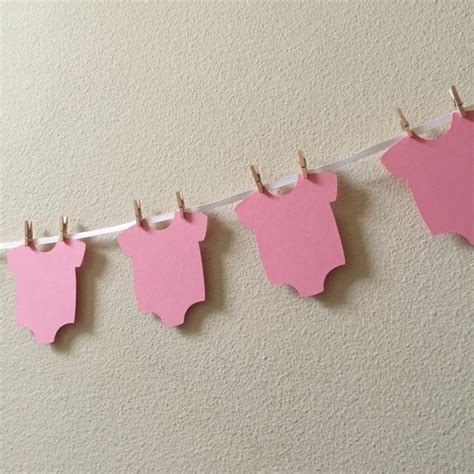 Fun & cute text ideas for your baby shower banner. Onesie Garland, Onesie Banner, DIY Onesie Banner, Baby Shower Ban | aftcra