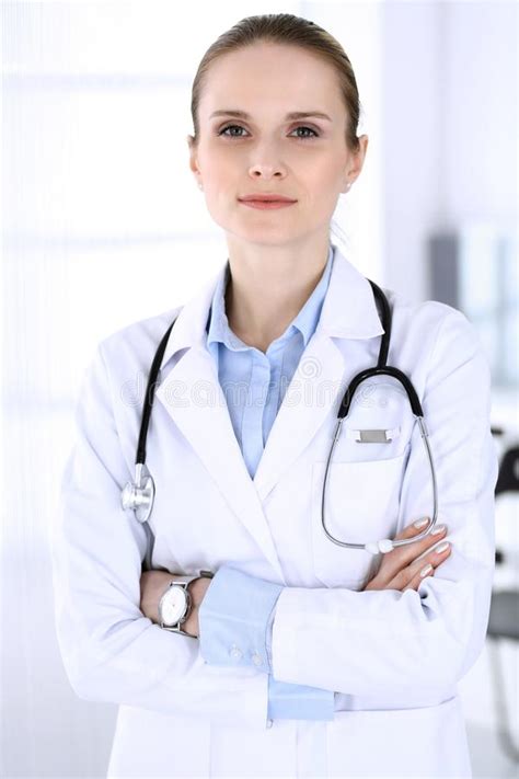 Doctor Woman Headshot At Work In Hospital Physician Standing Straight