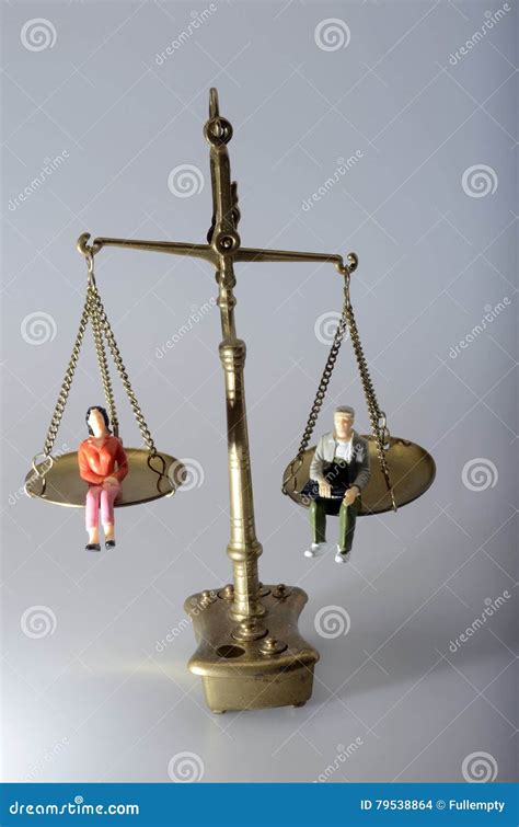 Man And Woman Sitting On Golden Weighing Scale Stock Photo Image Of