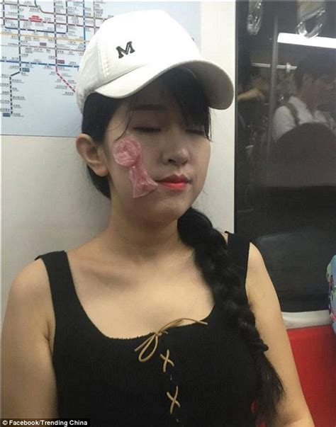 Girls In Beijing Pictured On A Busy Train With Condoms On Their Faces Daily Mail Online