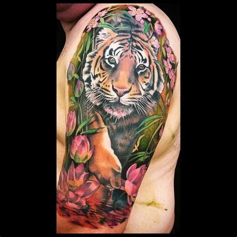 This half sleeve japanese tattoo showing a tiger and cherry blossoms is still in progress and needs one more session to get. Tiger tattoo | Tiger tattoo sleeve, Sleeve tattoos, Tiger ...