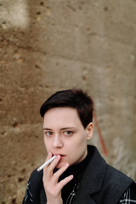 lesbian woman smoking del colaborador de stocksy alexey kuzma stocksy