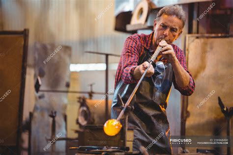 Glassblower Shaping A Glass On The Blowpipe At Glassblowing Factory — Work Hand Tool Stock