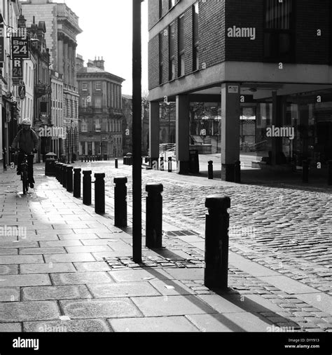 Urban Landscape Image Of Cobbled City Street In Monochrome Film Noir