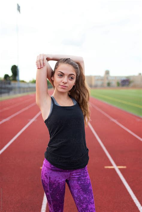 A Teenage Girl Working Out On Her Highschool Track By Chelsea Victoria