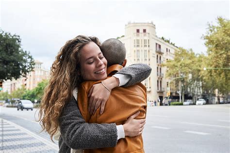Best Friends Hugging Street By Stocksy Contributor Ivan Gener Stocksy