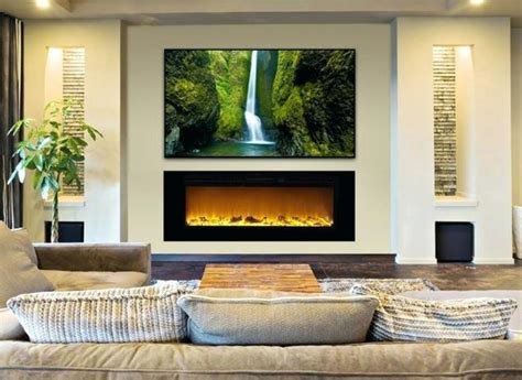 A Living Room With Couches And A Large Painting On The Wall In Front Of It