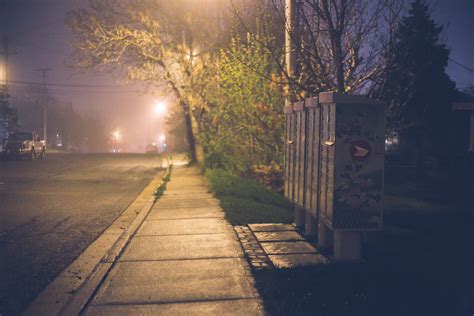 Empty Sidewalk Near Road Illuminated By Street Lights At Night · Free