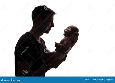 Silhouette Of A Father Holding His Newborn Baby Stock Image Image Of