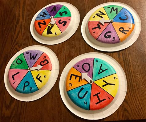 Make Letter Spinners With Paper Plates And Brass Fasteners Sooo Easy