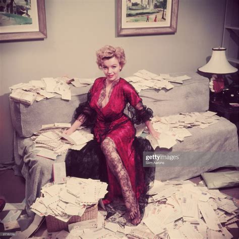 Premium Rates Apply Marilyn Monroe Wearing A Red Negligee Trimmed Slim Aarons Slim