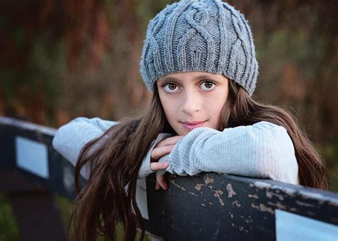 Beautiful Young Tween Girl In Sweater And Hat Outdoors In Fall