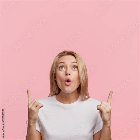 Beautiful Shocked Young Female With Blonde Hair And Surprised Face