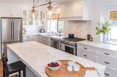 White black light wood dark wood. White Shaker Cabinets & Carrera Marble Kitchen Remodel ...