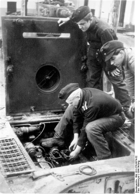 Photo German Tankers Performing Repair Or Maintenance On The Engine