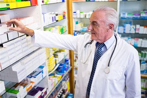 Pharmacist Checking Medicines In Pharmacy Stock Image Image Of