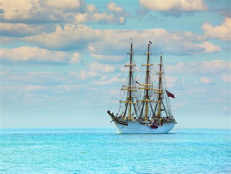 Tall Ship Sailing On Aqua Sea As Storm Clouds Form Above Photograph By
