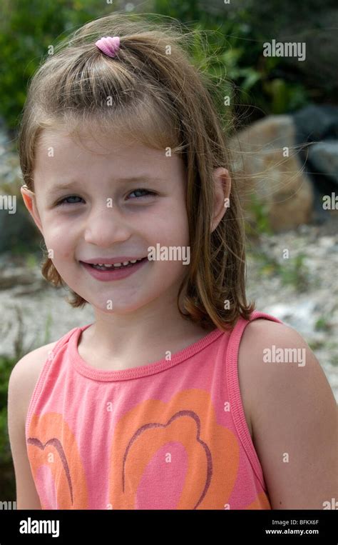 Pretty Young Girl Posing And Smiling Stock Photo Alamy