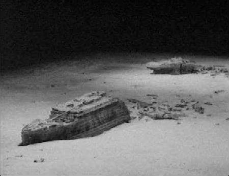 Titanic was attacked and sunk in 1912 near newfoundland by laser shots fired from an alien submarine. The broken Titanic at the bottom of the Atlantic. Description from pinterest.com. I searched for ...