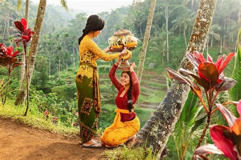 premium photo indonesian girls in traditional clothes with a fruit basket bali indonesia