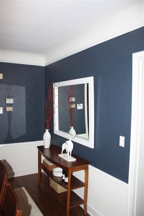 Color and trim give a lackluster dining room a formal but eclectic update. A "Tweaked" Dining Room | Paint ideas, Blue office and Room