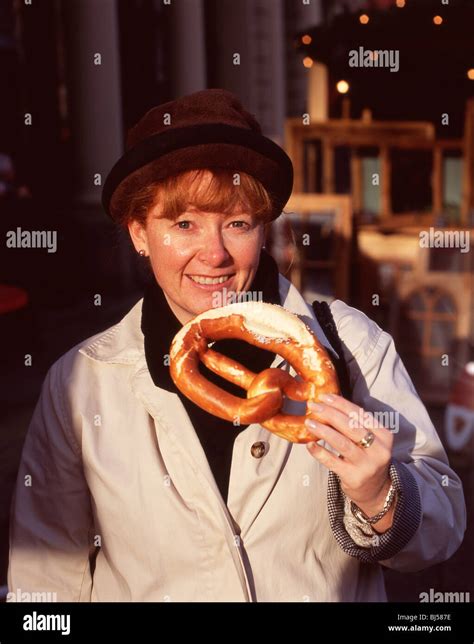 Woman Eating Pretzel Hi Res Stock Photography And Images Alamy