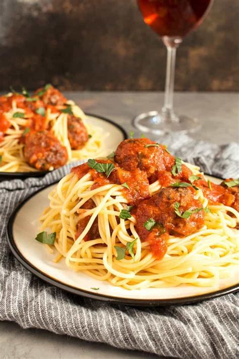 This easy recipe uses ground pork and beef, plus loads of parm. Easy Homemade Spaghetti and Meatballs » The Thirsty Feast
