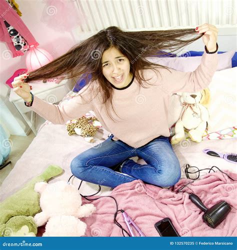 Cute Young Woman In Her Bedroom Screaming For Messy Hair Stock Image