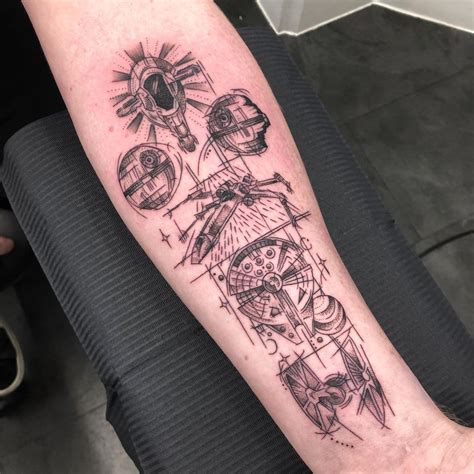 A Person With A Tattoo On Their Arm That Has An Image Of A Spaceship In It