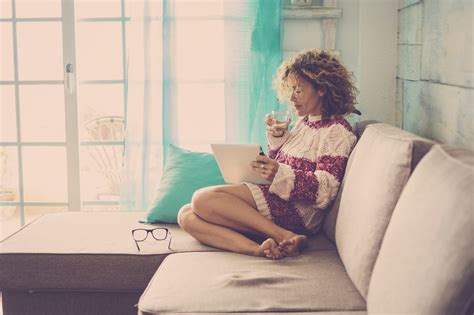 Beautiful Caucasian Middle Age Woman With Curly Hair Working At Home